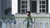 A Chinese paramilitary police officer stands guard outside the Australian embassy in Beijing on Feb. 5, 2024.