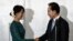 South Korean President Lee Myung-bak, right, shakes hands with Burma opposition leader Aung San Suu Kyi after their joint press conference at a hotel in Rangoon, May 15, 2012.