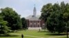 FILE - People walk on Johns Hopkins University's Homewood campus in Baltimore, Md.