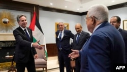 FILE - US Secretary of State Antony Blinken (L) meets with Palestinian President Mahmoud Abbas, in Amman, Jordan on October 17, 2023. President Joe Biden will visit Israel on October 18 as Washington tries to prevent war from spilling into a wider Middle East conflict.