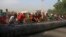 Sudanese erect barricades as they protest against a military coup that overthrew the transition to civilian rule, on October 25, 2021 in the al-Shajara district in southern Khartoum, in Sudan.
