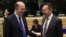 France's Finance Minister Pierre Moscovici talks with Greece's Finance Minister Yannis Stournaras (R) during a Eurogroup meeting in Brussels, December 13, 2012. 