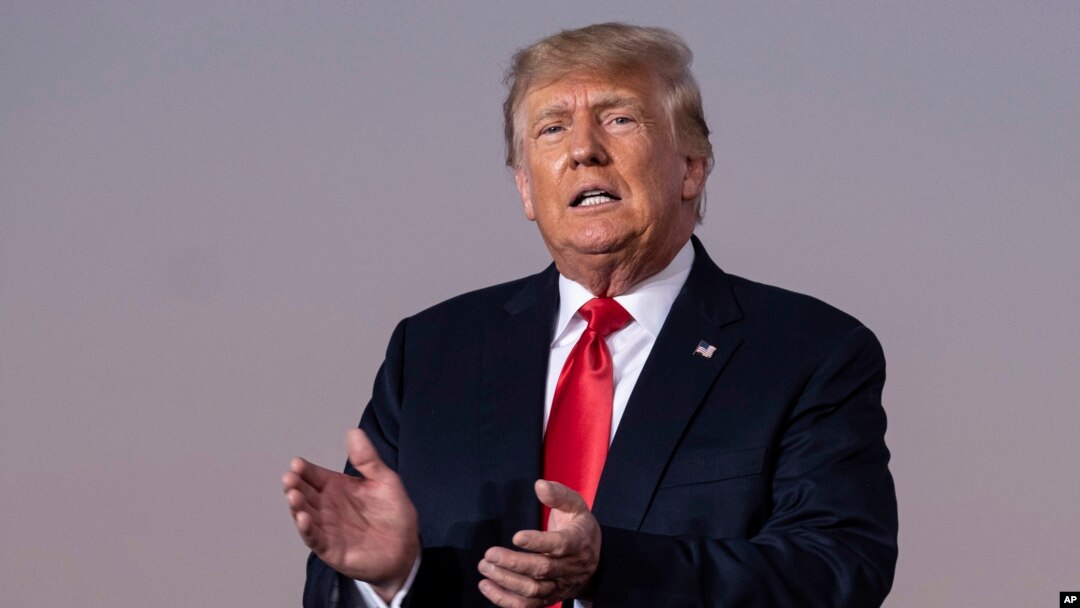 FILE — Former President Donald Trump prepares to take the stage during his Save America rally in Perry, Ga., Sept. 25, 2021.