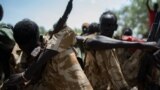 Child soldiers listen to a speech after being released from a group called the Cobra Faction and from the main SPLA/IO rebel faction during a ceremony in Tenet, near Pibor, South Sudan, Oct. 26, 2016. 