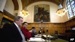 Nicaragua's Carlos Jose Arguello Gomez and his legal team await the start of the ruling on Costa Rica's request for emergency measures amid a border dispute with Nicaragua at the International Court of Justice, The Hague, March 8, 2011