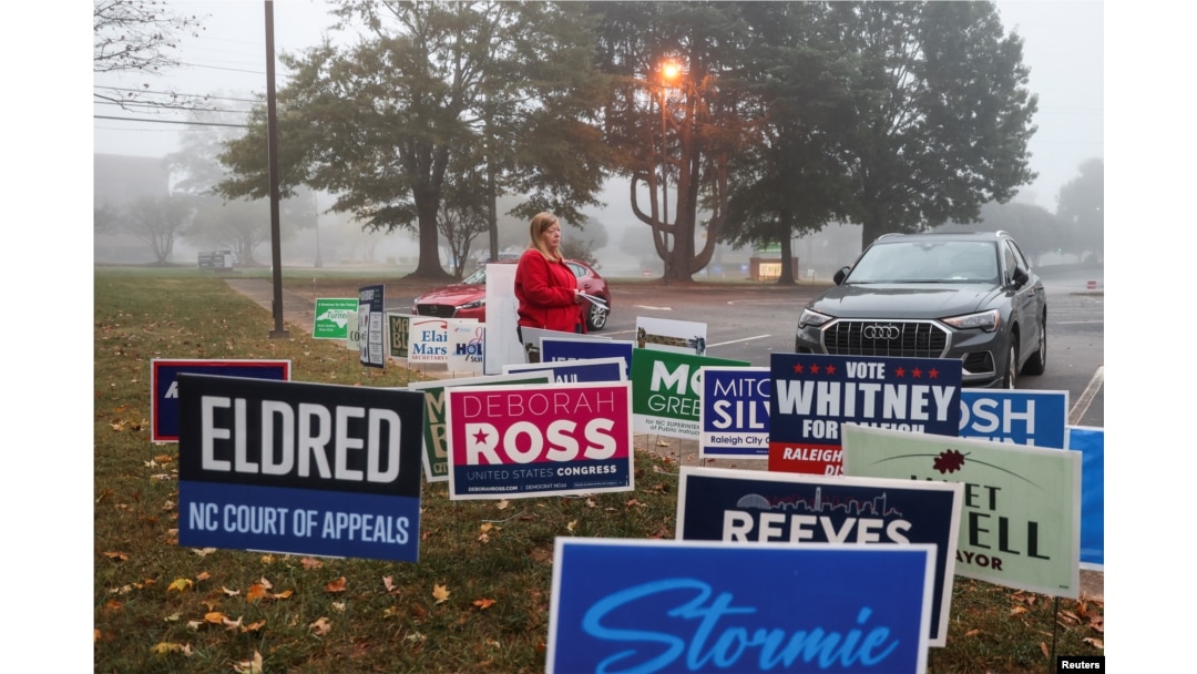 FILE - A woman walks near a polling station on the day of the 2024 U.S. presidential election in Raleigh, North Carolina, Nov. 5, 2024.
