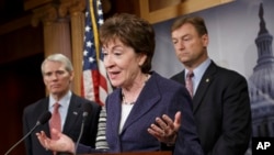Sen. Susan Collins, R-Maine, center, flanked by Sen. Dean Heller, R-Nev., right, and Sen. Rob Portman, R-Ohio, left, discuss their concerns about the political fight over legislation to restore benefits to long-term jobless workers, Jan. 14, 2014, during a news conference on Capitol Hill in Washington. 
