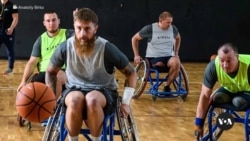 Wounded Ukranian warfare  vets bid     for wintry sports contention  