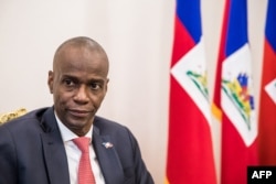 FILE - President Jovenel Moise sits at the Presidential Palace during an interview in Port-au-Prince, Oct. 22, 2019.