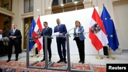 FILE - From left: Austrian Chancellor and head of the People's Party Karl Nehammer, head of the Social Democrats Andreas Babler and head of NEOS party Beate Meinl-Reisinger announce the start of coalition negotiations in Vienna, Nov. 18, 2024