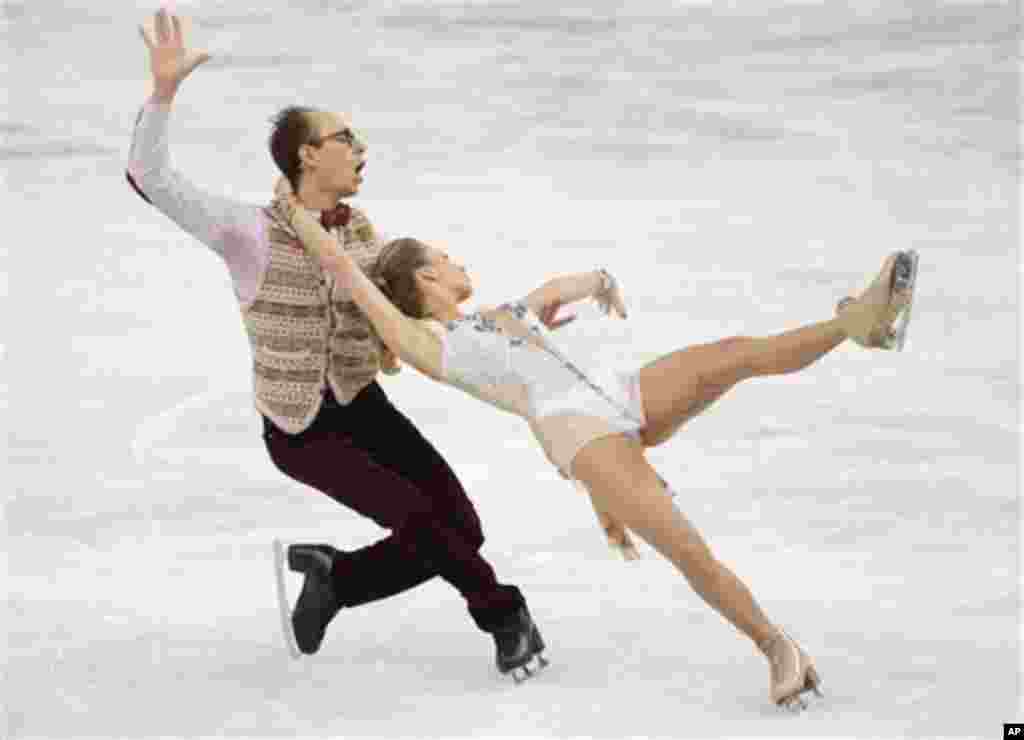 Nelli Zhiganshina and Alexander Gazsi of Germany compete in the ice dance short dance figure skating competition at the Iceberg Skating Palace during the 2014 Winter Olympics, Sunday, Feb. 16, 2014, in Sochi, Russia. (AP Photo/Bernat Armangue)