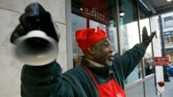 Salvation Army, in red aprons ringing bells