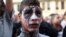 An Egyptian youth wears face paint at a demonstration outside the country's high court in Cairo, Egypt, April 6, 2013. 