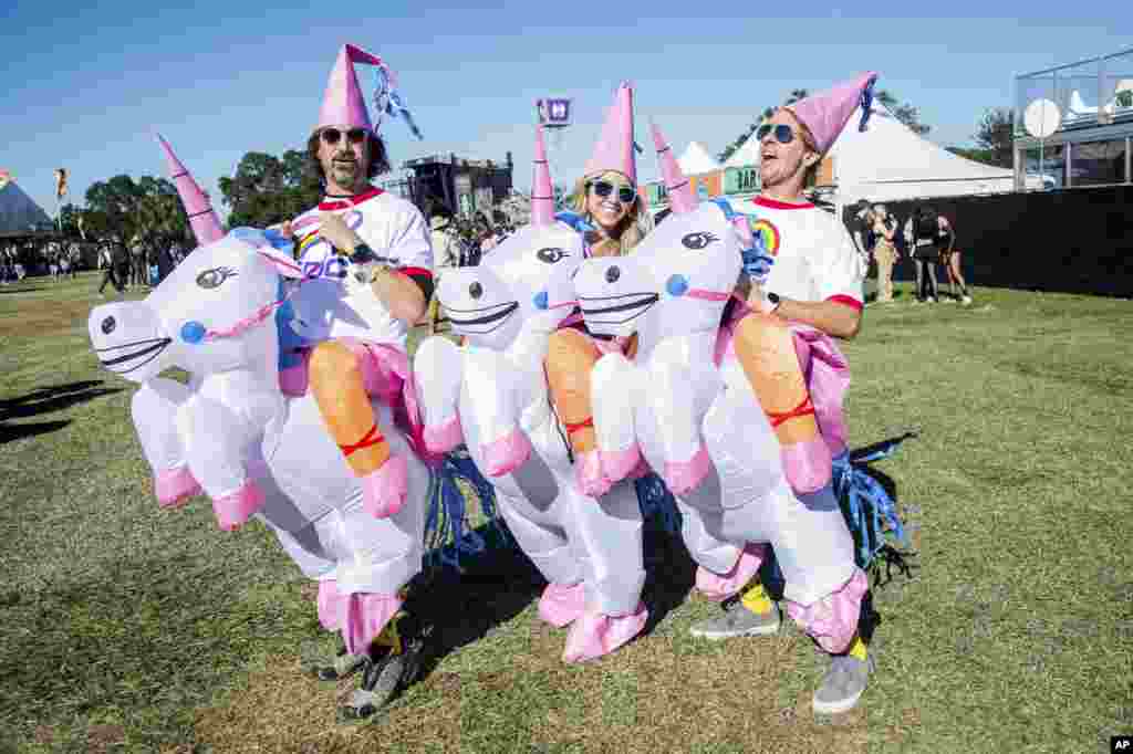 Festival goers in Halloween costumes attend the Voodoo Music Experience in City Park on Oct. 29, 2017, in New Orleans.