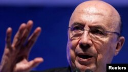 Brazilian Finance Minister Henrique Meirelles gestures during a meeting with businessmen in Sao Paulo, Brazil, Sept. 14, 2017. 