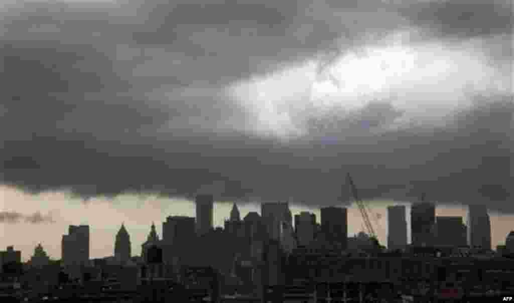 Dark clouds form over New York's downtown skyline on Thursday April 28, 2011. The National Weather Service says a line of severe thunderstorms capable of producing a tornado is moving into the area and has issued a tornado warning for Rockland County and