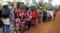 People queue as they wait to cast their votes in the Kenya election in Gatundu in Kiambu county, Kenya, Aug. 8, 2017.