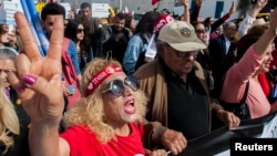 Tunisian demonstrators shout during a protest seeking equality between men and women in Tunis, Tunisia, March 10, 2018.