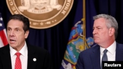 New York Governor Andrew Cuomo and New York City Mayor Bill de Blasio deliver remarks at a news conference regarding the first confirmed case of coronavirus in New York State in Manhattan borough, March 2, 2020.