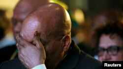 Le président sud-africain Jacob Zuma réagit à l'annonce officielle des résultats de l'élection municipale à Pretoria, Afrique du sud, le 6 août 2016. 