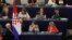 An usher of the European Parliament holds Croatia's national flag during a ceremony marking the start of the country's membership in the E.U., at the European Parliament in Strasbourg in this July 1, 2013, file photo.