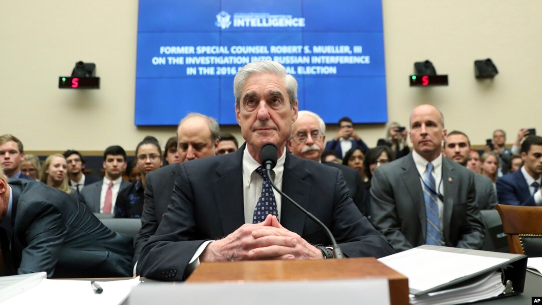 Former special counsel Robert Mueller listens to committee members give their opening remarks before he testifies before the House Intelligence Committee on his report on Russian election interference, on Capitol Hill, in Washington, July 24, 2019.