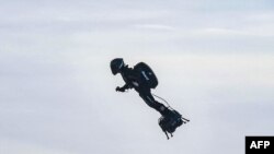 Franky Zapata stands on his jet-powered "flyboard" after he took off from Sangatte, France, Aug. 4, 2019, in an attempt to fly across the 35-kilometer (22-mile) Channel crossing in 20 minutes.