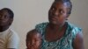 A mother waits for her child's turn to be operated on by the Operation Smile surgeons at Zomba Central Hospital in Malawi. (VOA/L. Masina)