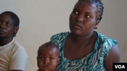 A mother waits for her child's turn to be operated on by the Operation Smile surgeons at Zomba Central Hospital in Malawi. (VOA/L. Masina)