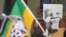 A photo of former South African president, late Nelson Mandela, right, is displayed during a remembrance ceremony in Qunu, South Africa, Saturday, Dec. 7, 2013. 