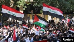 Mahasiswa Irak berkumpul selama aksi protes untuk mendukung warga Palestina di Gaza, di ibu kota Baghdad, 18 Oktober 2023. 