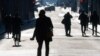 People are seen silhouetted while they walk at Via del Corso street, as Italy goes back to lockdown as part of efforts put in place to curb the spread of the coronavirus disease (COVID-19), in Rome, Italy, Dec. 31, 2020.