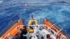 Coast guard members rescue survivors of a boat that had set off from Libya a few days ago, and shipwrecked near the Sicilian island of Lampedusa, Italy, Sept. 4, 2024, in this screen grab from video. (Guardia Costiera/Handout via Reuters)