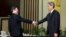 Wang Yu-chi, left, head of Taiwan's Mainland Affairs Council, shakes hands with Zhang Zhijun, director of China's Taiwan Affairs Office, Nanjing, Feb. 11, 2014.