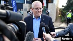 Australian Prime Minister Scott Morrison speaks to the media as he arrives at the Horizon Church in Sutherland in Sydney, Australia, May 19, 2019. (AAP Image/Joel Carrett/via Reuters)