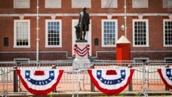 A statue of George Washington is displayed along the route of a parade in Philadelphia, Pennsylvania.