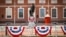 A statue of George Washington is displayed along the route of a parade in Philadelphia, Pennsylvania.