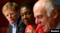 U.N. humanitarian chief Valerie Amos, center, and World Health Organization (WHO) Assistant Director General Bruce Aylward, left, listen to Dr. David Nabarro, senior U.N. coordinator for Ebola, speak during a news conference on Ebola at the United Nations