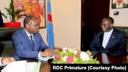 Freddy Matungulu (G), mokambi ya BAD (Banque africaine de développement) na masolo Ministre wa yambo Sylvestre Ilunga Ilunkamba na Kinshasa, RDC, 4 novembre 2019. (Primature RDC)