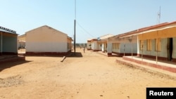 People walk at the Government Science secondary school in Kankara district, after it was attacked by armed bandits, in northwestern Katsina state, Nigeria, Dec. 12, 2020.