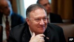 U.S. Secretary of State Mike Pompeo listens during a Cabinet meeting in the Cabinet Room of the White House, July 16, 2019, in Washington. 