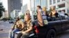 Black Lives Matter protester Jaborey Burns (C) rides around with members of the Texas Guerrillas as they patrol a Black Lives Matter rally in Austin, Texas, U.S., August 1, 2020. A member of the Guerrillas described the group as "all inclusive without…