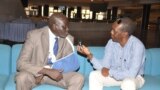 Aggrey Idris (arm in sling), interviewed by VOA's John Tanza Addis Ababa in 2015. (Photo: South Sudan in Focus)