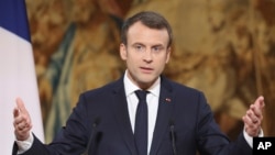 FILE - French President Emmanuel Macron delivers his New Year address to the press at the Elysee Palace in Paris, Jan. 3, 2018. 