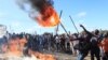 FILE: Rioters battle with Zimbabwean police in Harare, Monday, July, 4, 2016. 