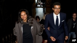 FILE - Daughter of former Angolan President Jose Eduardo dos Santos, Isabel dos Santos, and her husband Sindika Dokolo arrive for an event at the City Hall in Porto, Portugal, March 5, 2015. 