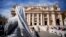 FILE - A nun waits for the arrival of Pope Francis for his weekly general audience, in St. Peter's Square at the Vatican, Sept. 26, 2018.
