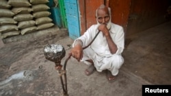 FILE: A man smoking in a hookah. Taken Jul 4, 2011. 