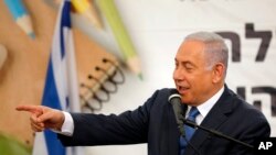 Israeli Prime Minister Benjamin Netanyahu speaks during a ceremony opening the school year in the settlement of Elkana, Sept. 1, 2019. Netanyahu reaffirmed his pledge to impose Israeli sovereignty on West Bank settlements.