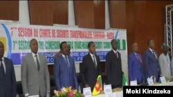 Delegates respect the Cameroon and Nigerian anthem during the Yaounde security meeting in Camerron, July 6, 2019. ( Moki Kindzeka/VOA) 